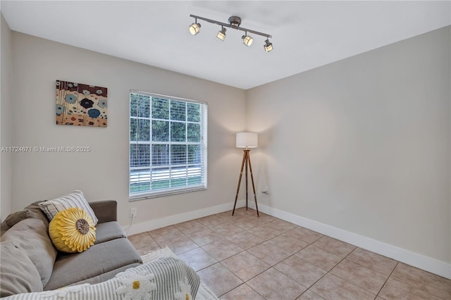 interior space featuring rail lighting and light tile patterned floors