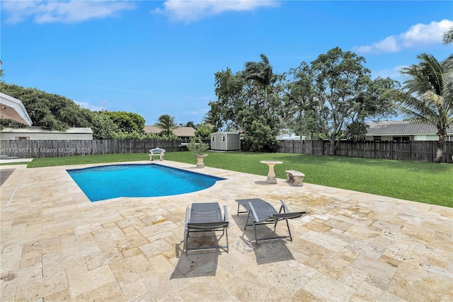 view of swimming pool featuring a lawn and a patio