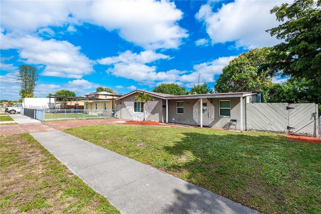 ranch-style home with a front lawn and a carport