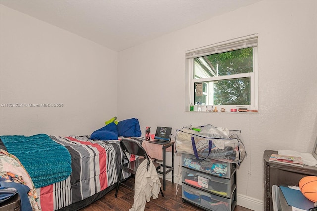 bedroom featuring dark wood-type flooring