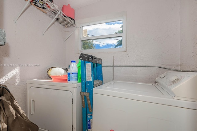 laundry room featuring separate washer and dryer