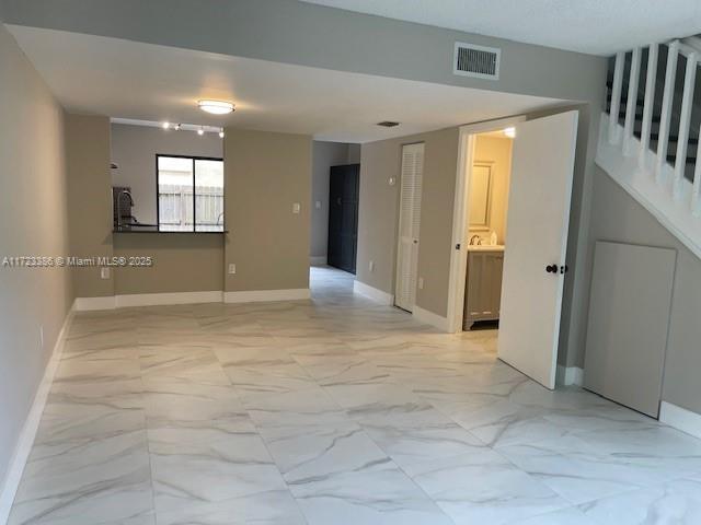 spare room with a textured ceiling