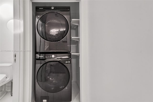 clothes washing area with stacked washer / drying machine