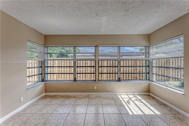 unfurnished sunroom featuring a healthy amount of sunlight