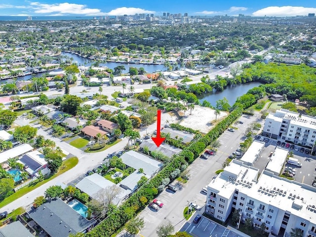 birds eye view of property featuring a water view