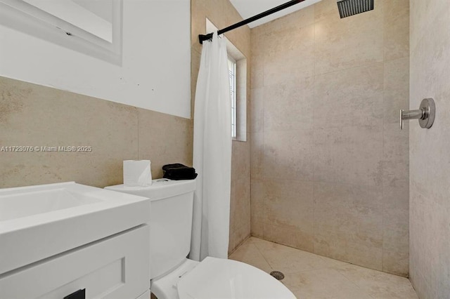 bathroom featuring toilet, tile walls, walk in shower, and tile patterned flooring