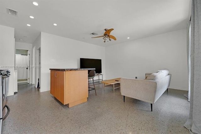 living room with ceiling fan