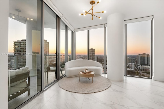 interior space with expansive windows and an inviting chandelier