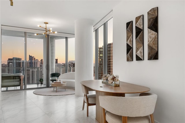 2900 NE 7th Ave Unit 3509, Miami, FL 33137 - dining area with a chandelier, a wall of windows, and marble finish floors