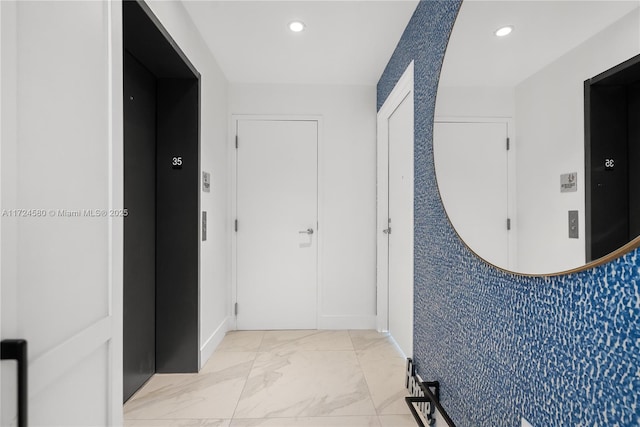 2900 NE 7th Ave Unit 3509, Miami, FL 33137 - hallway with elevator, recessed lighting, light marble finish flooring, and baseboards