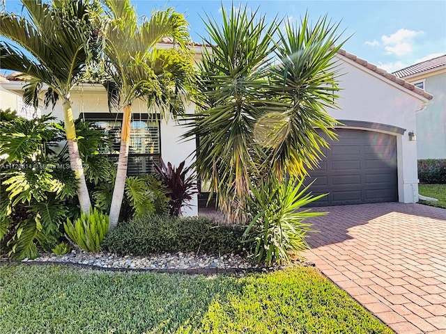 view of side of home featuring a garage