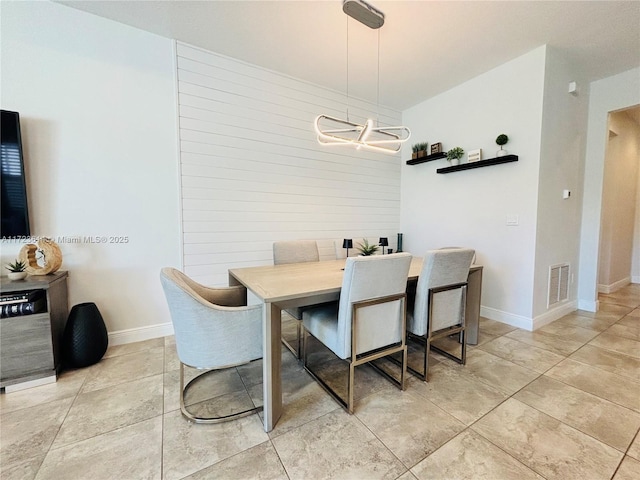 dining space with a chandelier