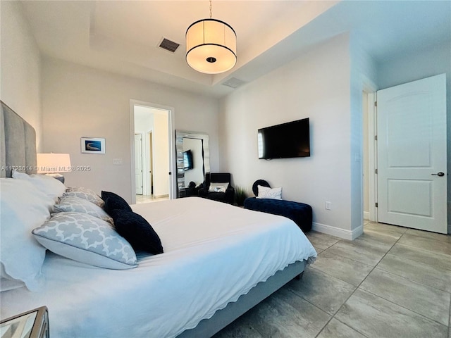 bedroom with a tray ceiling