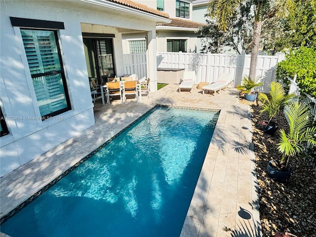 view of pool featuring a patio