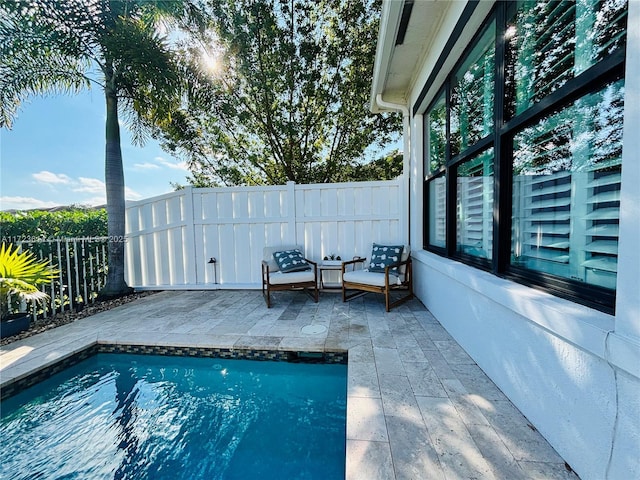 view of swimming pool featuring a patio