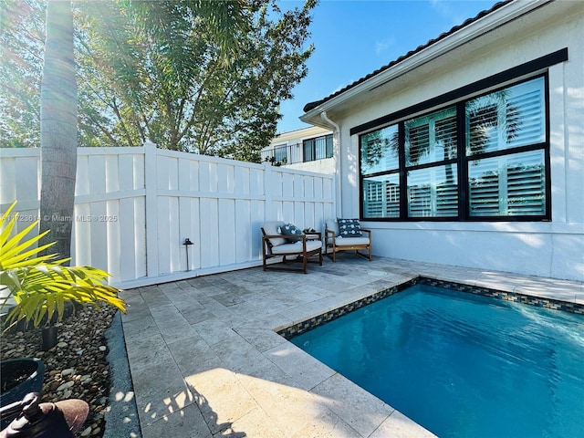 view of swimming pool with a patio