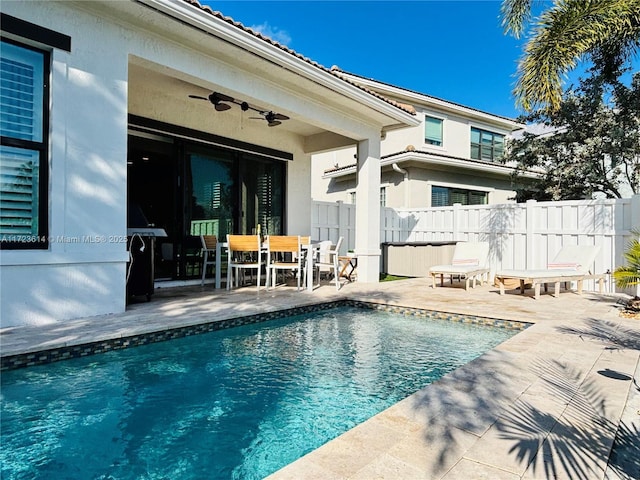 view of swimming pool with a patio and ceiling fan