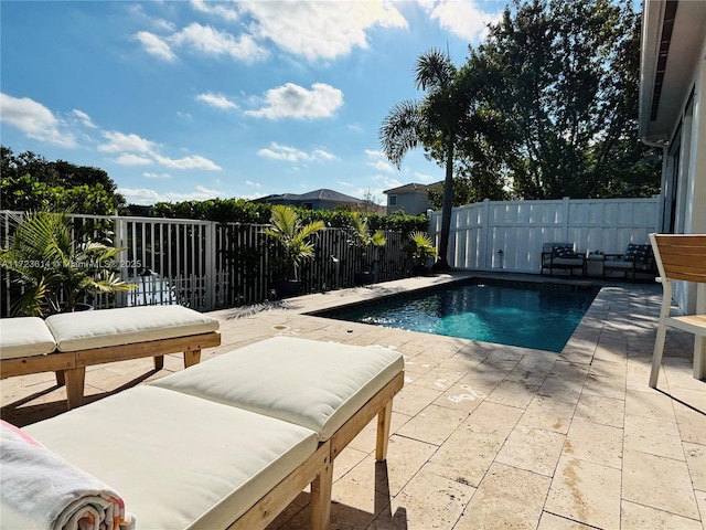 view of swimming pool with a patio