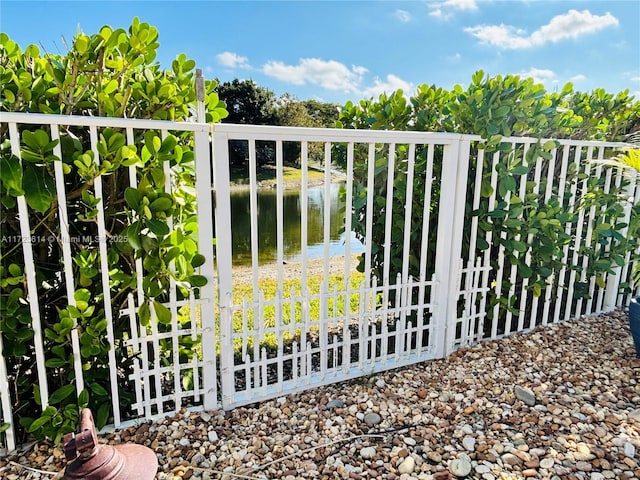 view of gate featuring a water view