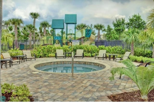 view of swimming pool featuring a playground