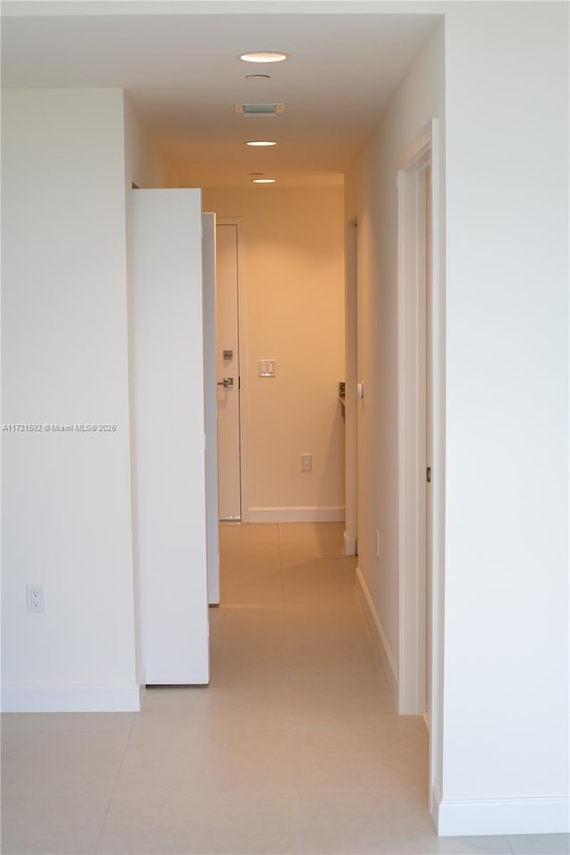 hallway featuring light tile patterned flooring