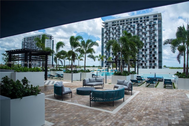 exterior space featuring an outdoor living space and a community pool