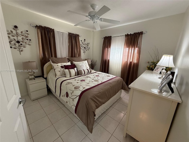 bedroom featuring ceiling fan and light tile patterned flooring