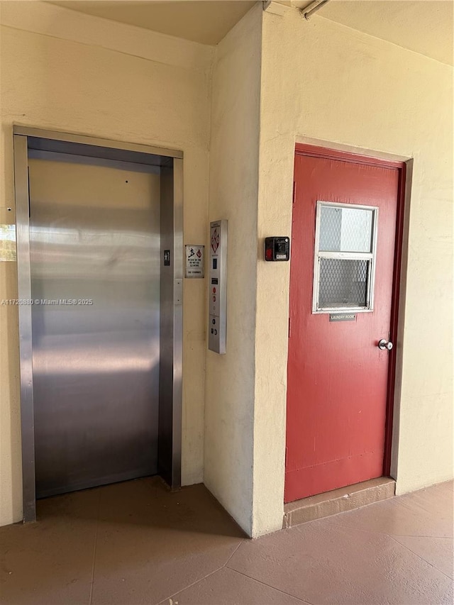 entrance to property featuring elevator