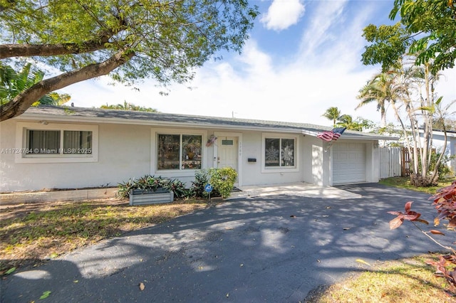 ranch-style home with a garage