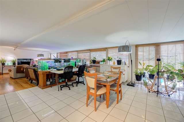 dining area featuring light tile patterned floors