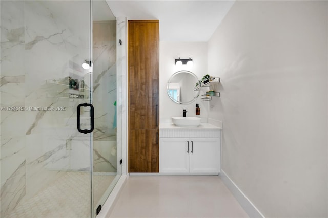 bathroom with a shower with door and vanity