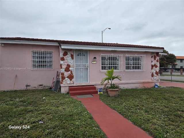 view of front of home with a front yard