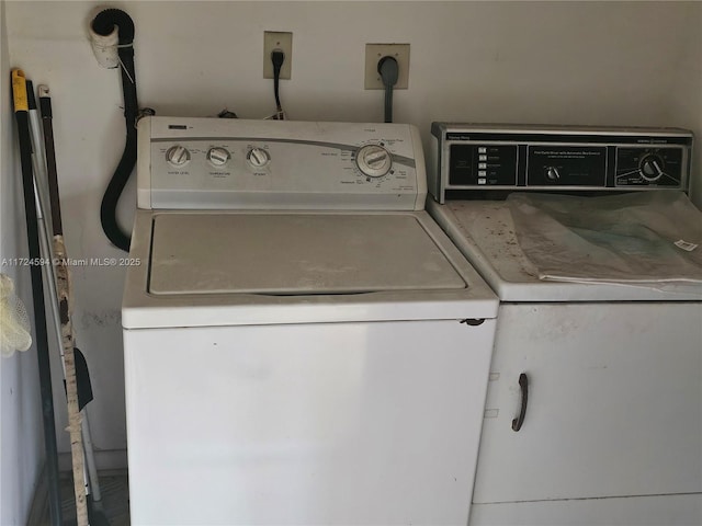 washroom with washer and dryer