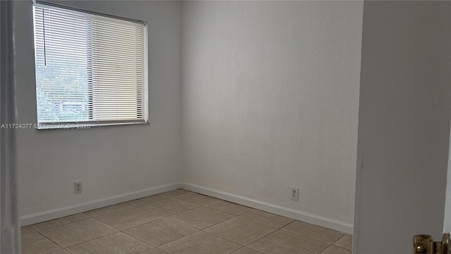 view of tiled spare room