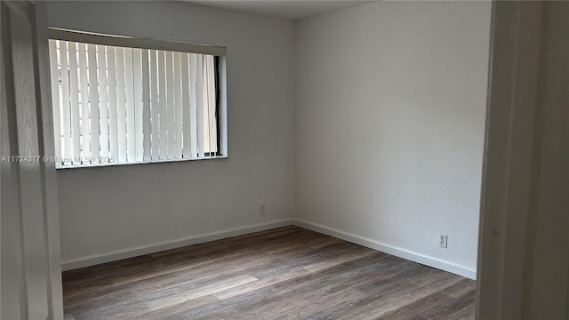 empty room with hardwood / wood-style flooring