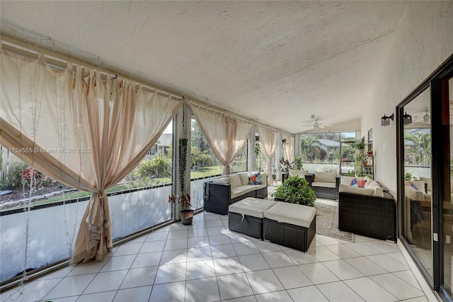 sunroom / solarium featuring ceiling fan