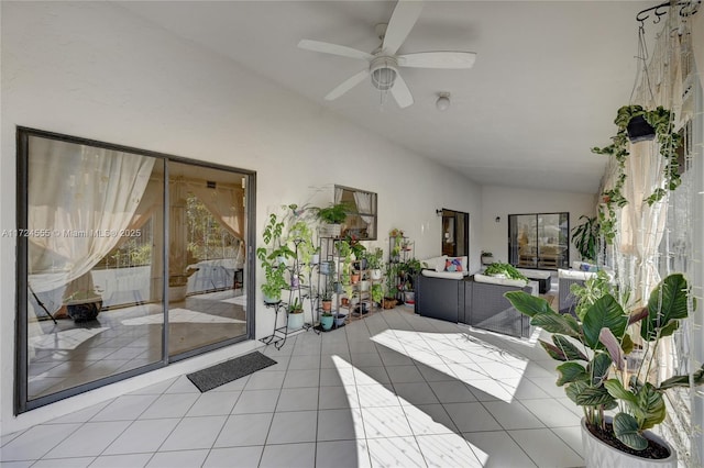 sunroom featuring a ceiling fan and vaulted ceiling