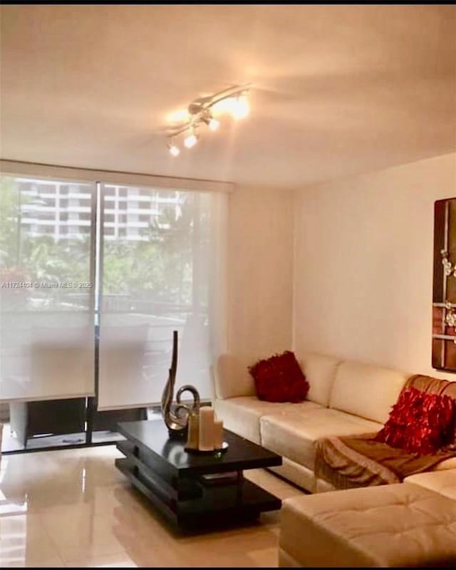 living room with tile patterned flooring