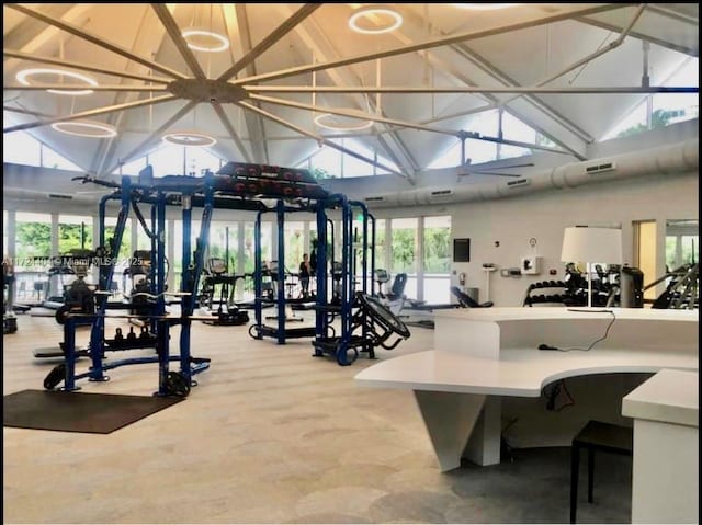 gym with high vaulted ceiling