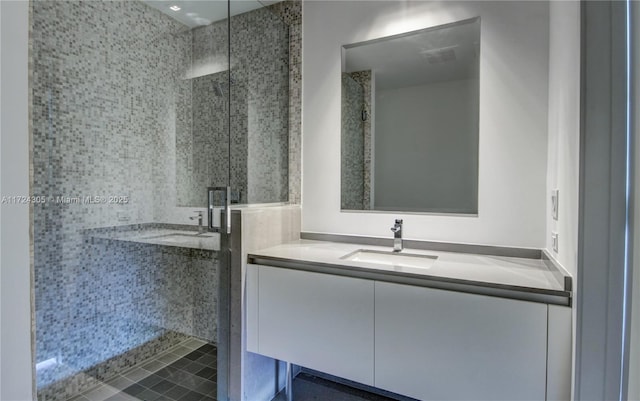 full bath featuring visible vents, a shower stall, and vanity