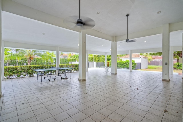 view of patio featuring fence and a ceiling fan