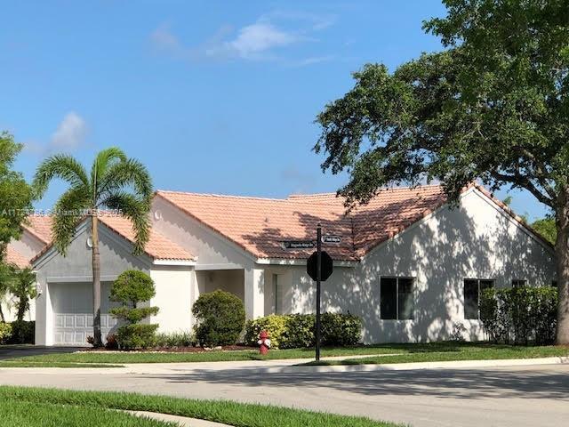 4357 Magnolia Ridge Dr, Weston, FL 33331 - ranch-style house with a garage, stucco siding, and a tiled roof