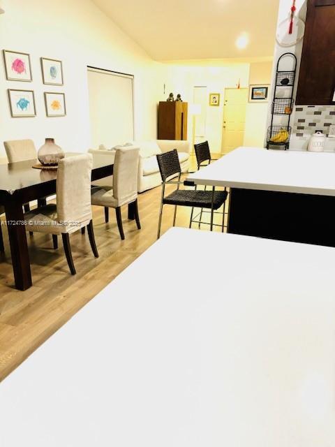 4357 Magnolia Ridge Dr, Weston, FL 33331 - dining area featuring light wood-type flooring and lofted ceiling