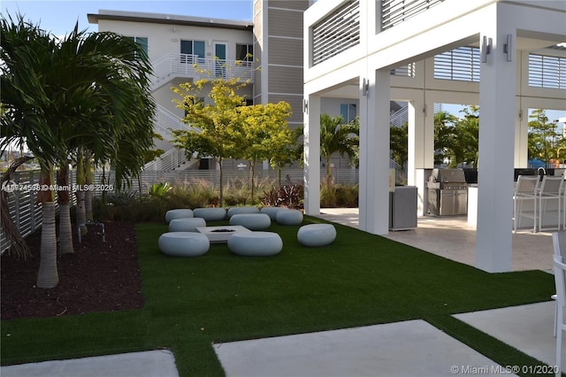 view of yard featuring area for grilling and a patio