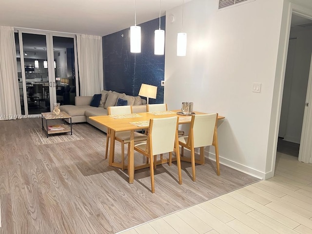 dining space featuring light hardwood / wood-style flooring