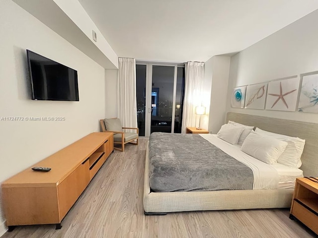 bedroom with light hardwood / wood-style flooring