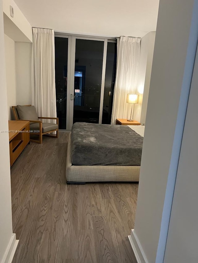 bedroom featuring hardwood / wood-style flooring