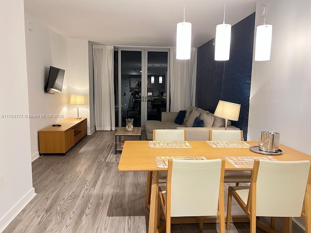 dining area with hardwood / wood-style floors