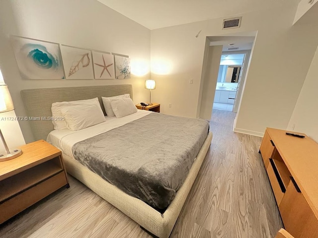 bedroom featuring hardwood / wood-style flooring