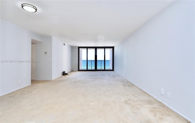 balcony featuring a water view and a beach view